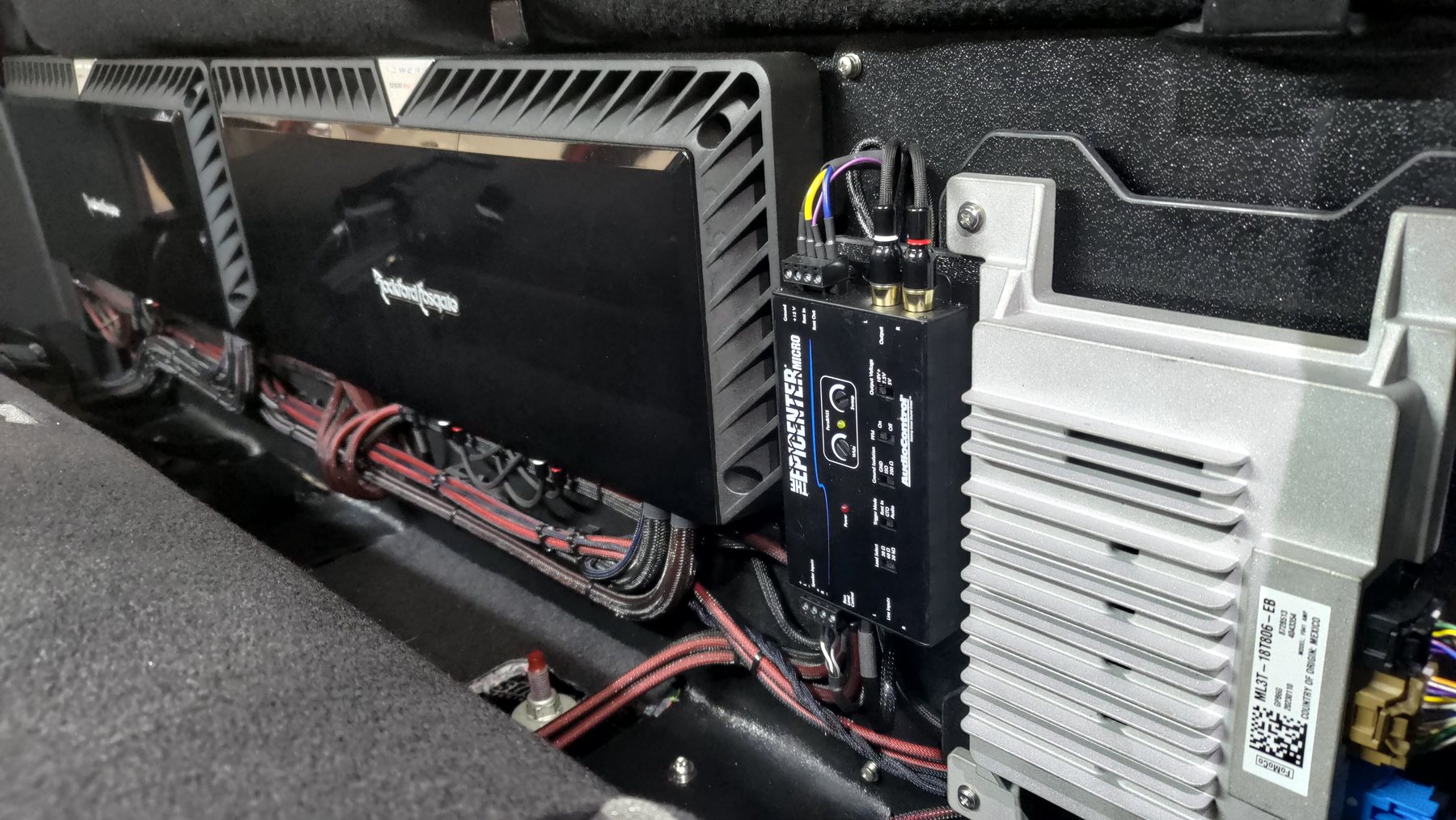 Amplifiers and distribution hardware mounted behind the rear seating area